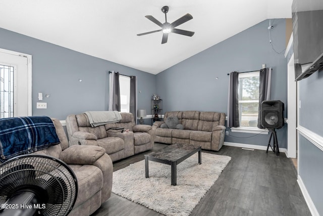 living room featuring lofted ceiling, ceiling fan, dark wood finished floors, and baseboards