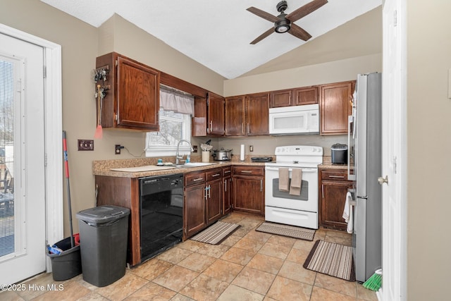 kitchen featuring white appliances, a ceiling fan, vaulted ceiling, light countertops, and a sink