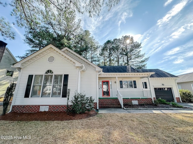 ranch-style house with a front yard, covered porch, crawl space, and an attached garage