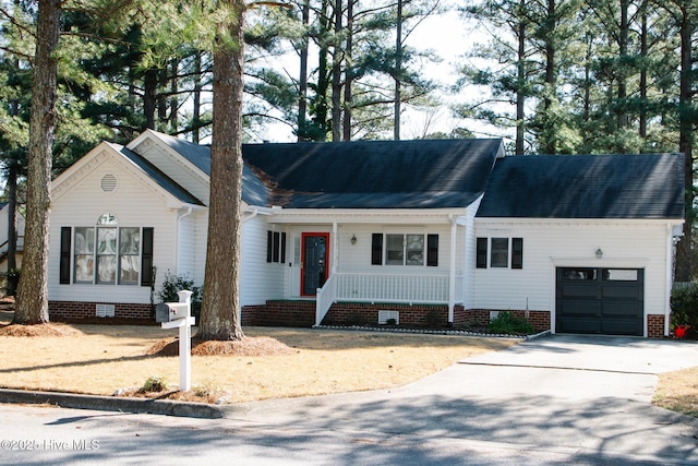 single story home with covered porch, concrete driveway, crawl space, and an attached garage