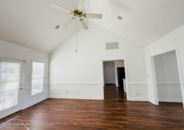 unfurnished room with baseboards, visible vents, a ceiling fan, wood finished floors, and high vaulted ceiling