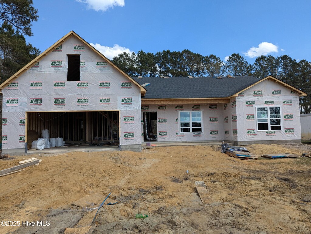 unfinished property with a garage