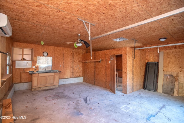 interior space featuring a sink and a wall unit AC