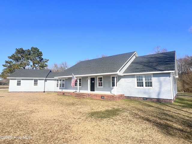 ranch-style house featuring crawl space, roof with shingles, a porch, and a front yard