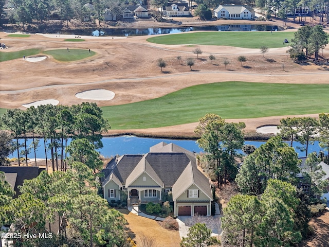 bird's eye view with view of golf course and a water view