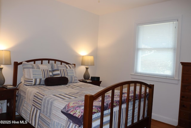 bedroom featuring baseboards