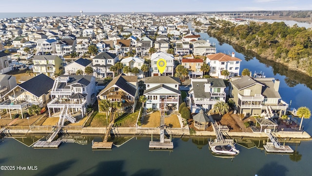 bird's eye view featuring a water view and a residential view