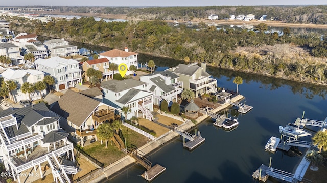 birds eye view of property featuring a water view and a residential view