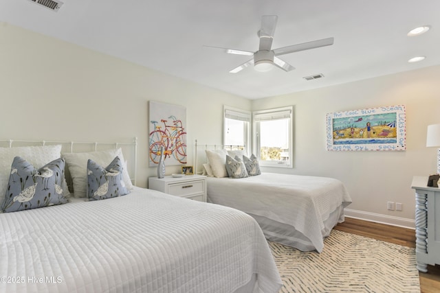 bedroom featuring visible vents, baseboards, ceiling fan, wood finished floors, and recessed lighting