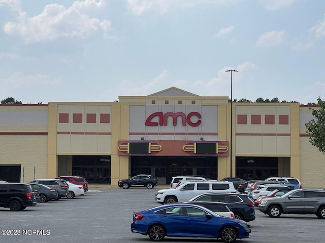 view of property featuring uncovered parking