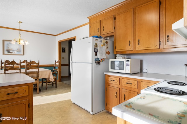 kitchen with light countertops, white appliances, brown cabinets, and pendant lighting