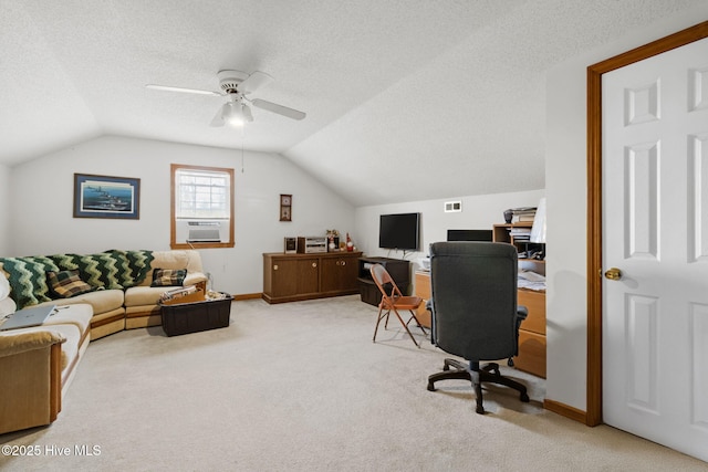 office area with baseboards, lofted ceiling, ceiling fan, a textured ceiling, and carpet floors