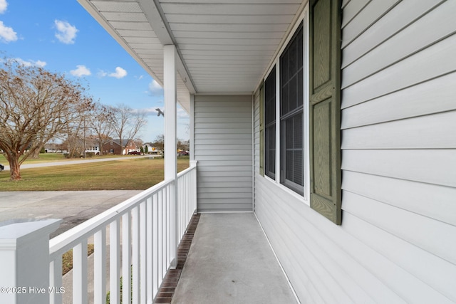 balcony featuring a residential view and a porch