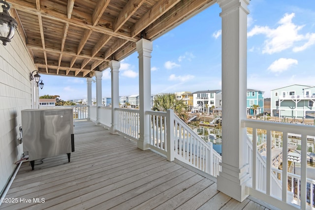 wooden deck with a residential view