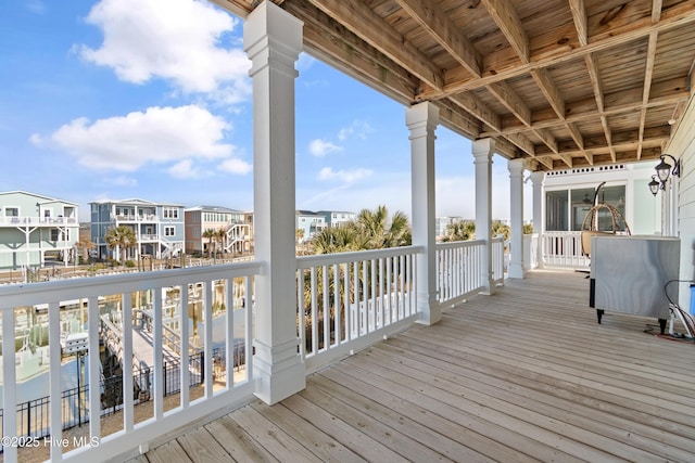 wooden terrace featuring a residential view