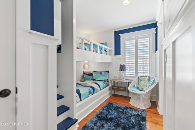 bedroom featuring wood finished floors