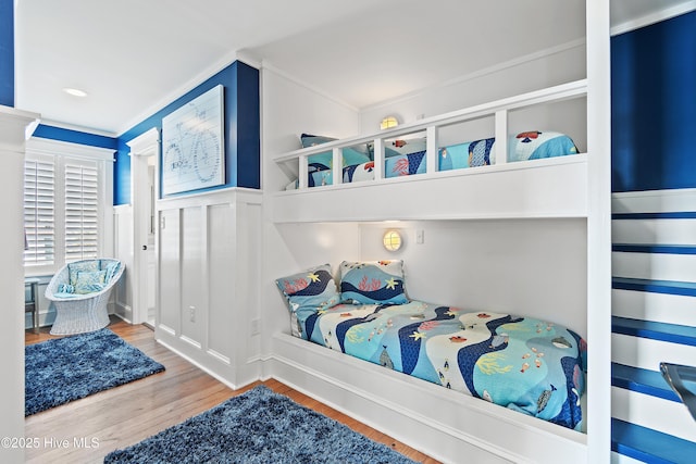 bedroom featuring wood finished floors