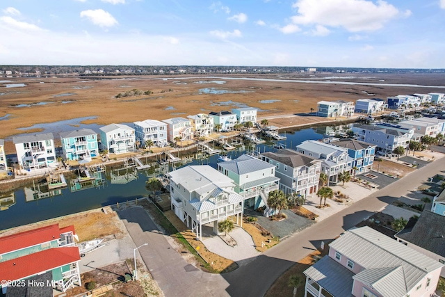 aerial view featuring a residential view and a water view