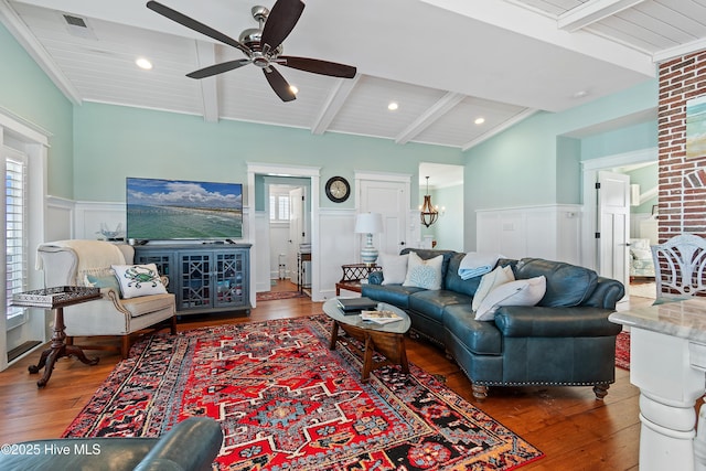 living room with hardwood / wood-style flooring, wood ceiling, a ceiling fan, and wainscoting