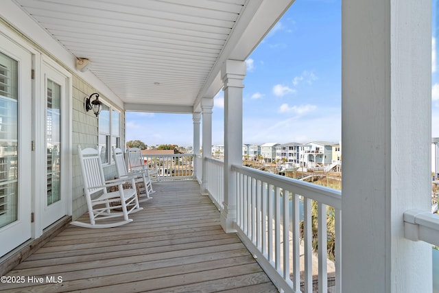 wooden deck with a residential view