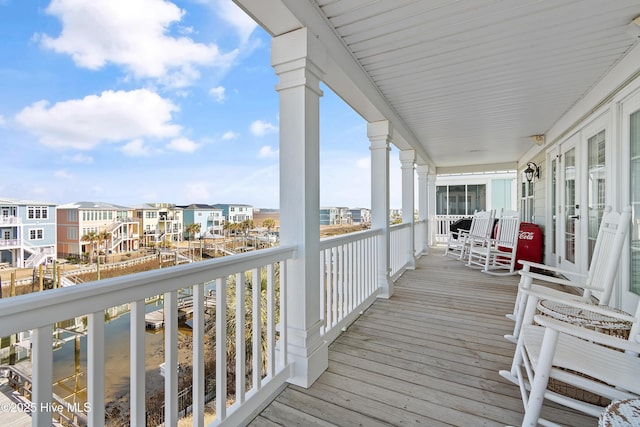 wooden terrace with a residential view