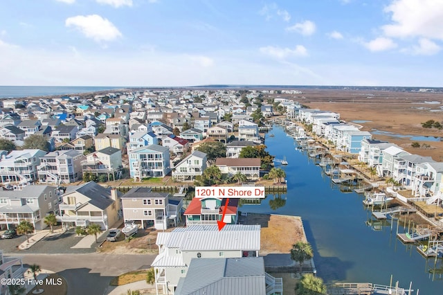 birds eye view of property featuring a residential view and a water view