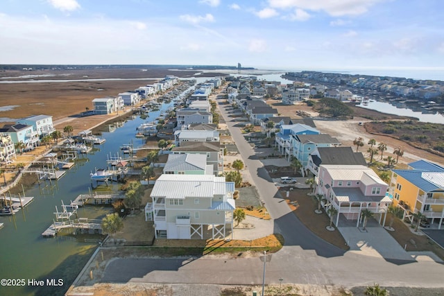 bird's eye view featuring a water view and a residential view