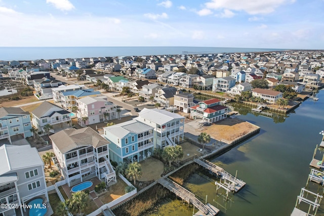 bird's eye view featuring a residential view and a water view