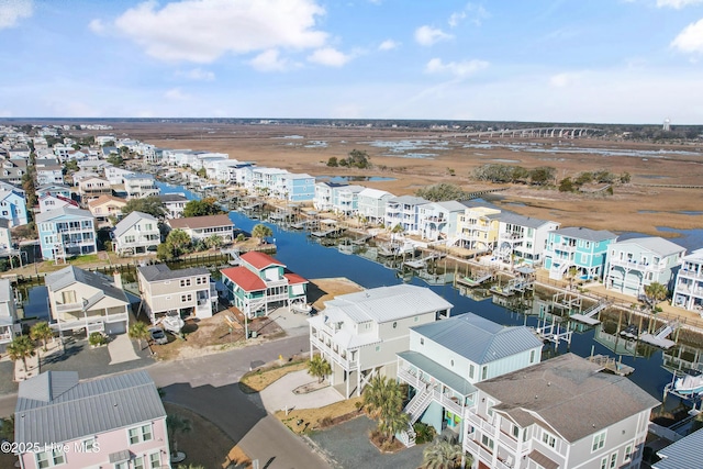 birds eye view of property with a residential view and a water view