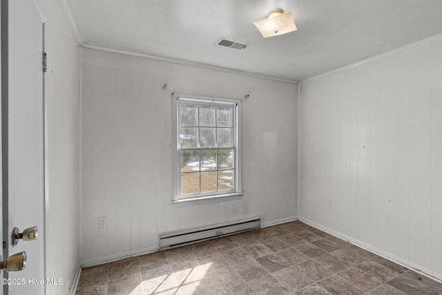 spare room with baseboards, visible vents, and baseboard heating