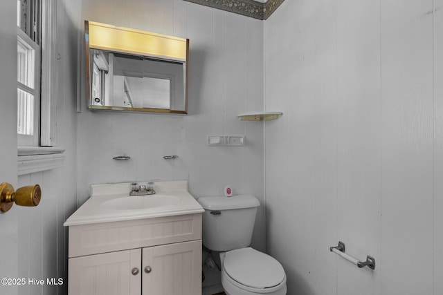 bathroom with toilet and vanity