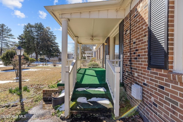 view of patio featuring a ceiling fan and a porch