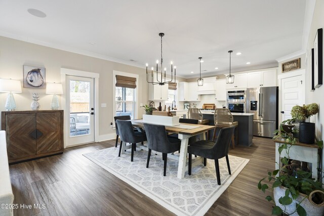 dining area featuring ornamental molding, recessed lighting, a chandelier, and dark wood-style floors