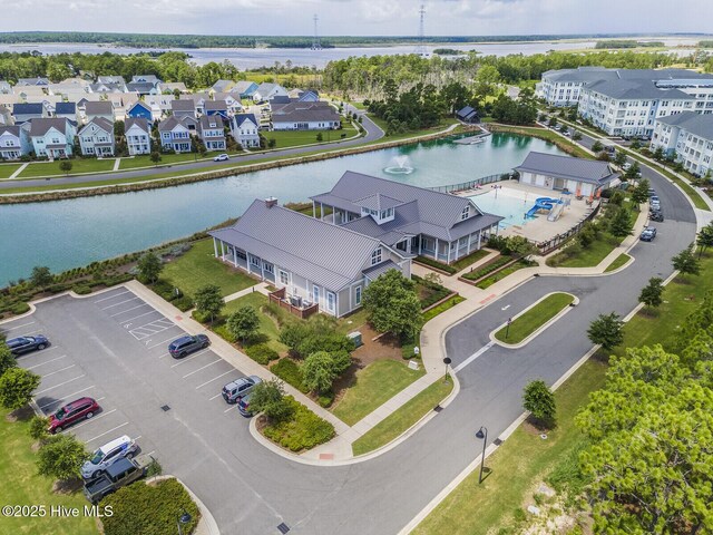 bird's eye view featuring a water view and a residential view