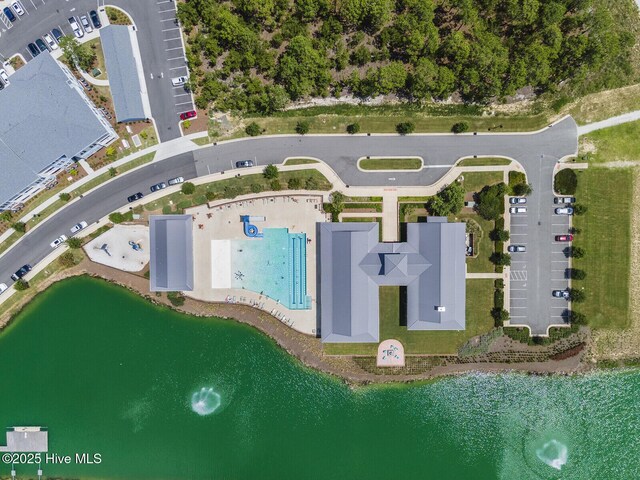 view of patio with an outdoor fire pit and a deck with water view