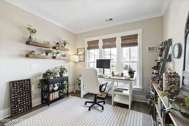 office area featuring baseboards, visible vents, ornamental molding, and wood finished floors