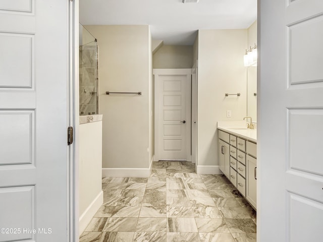 bathroom with marble finish floor, visible vents, vanity, baseboards, and walk in shower