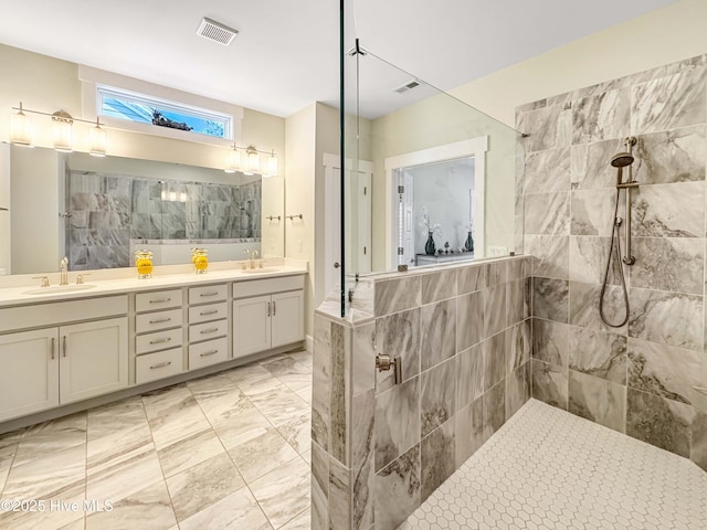 bathroom featuring a walk in shower, double vanity, a sink, and visible vents