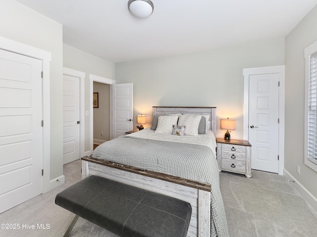 bedroom featuring baseboards and carpet flooring