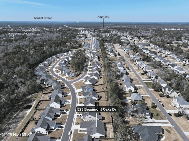 birds eye view of property with a residential view