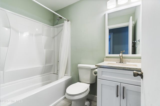 bathroom with shower / bath combo, vanity, and toilet