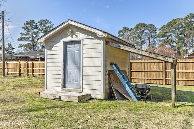 view of shed featuring a fenced backyard