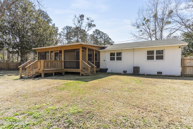 single story home featuring central AC, brick siding, fence, a sunroom, and crawl space