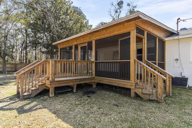 wooden deck featuring fence and a sunroom