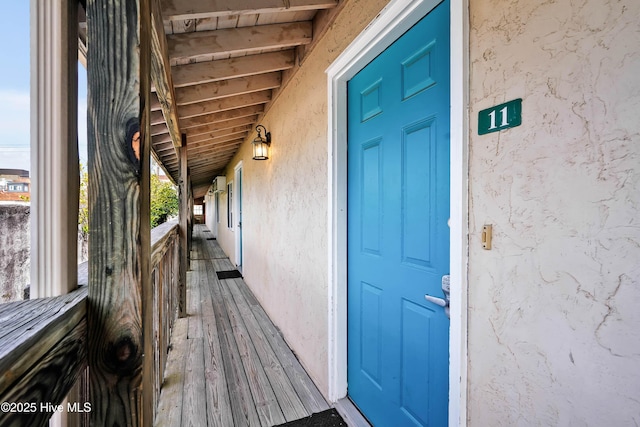 property entrance featuring stucco siding