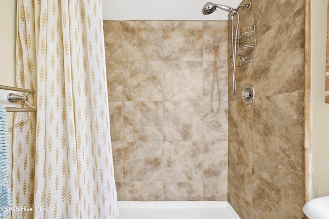 full bath featuring a tile shower