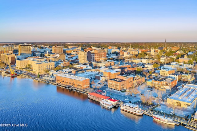 aerial view at dusk with a water view