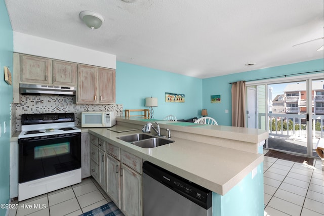 kitchen with range with electric cooktop, dishwasher, white microwave, a peninsula, and under cabinet range hood