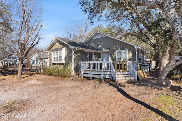 bungalow-style house with a wooden deck