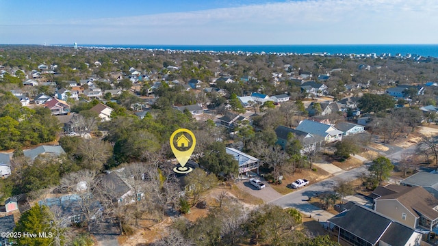 birds eye view of property with a water view and a residential view